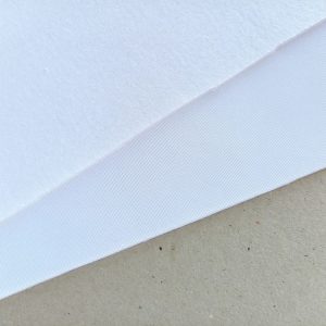 White laminated cut and sew foam fabric