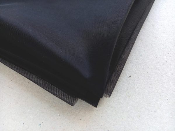 black non stretch sheer fabric folded