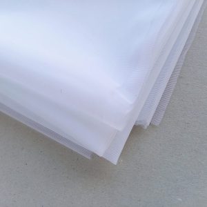 white non stretch sheer fabric folded