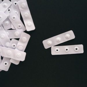 white plastic snap tape