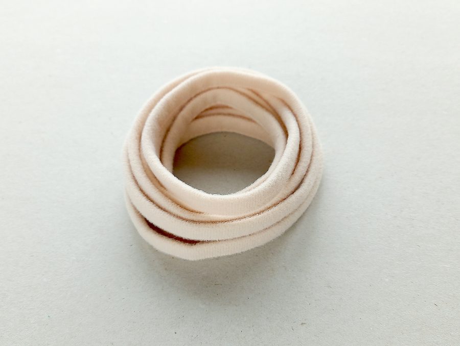 Hele roosakasbeež rinnahoidja tugikaare tunnelpael, pehme karvastatud pealispind, laius 11 mm roosakasbeež rinnahoidja tugitraadi ümbris tugikaare tunnelpael